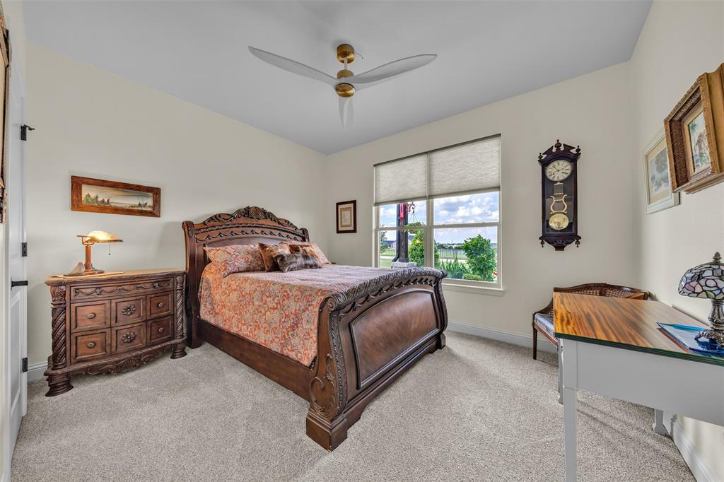 6628 Buffalo Ridge Circle Godley, TX 76044 - Photo 14 of 39 a bedroom with a bed dresser and window