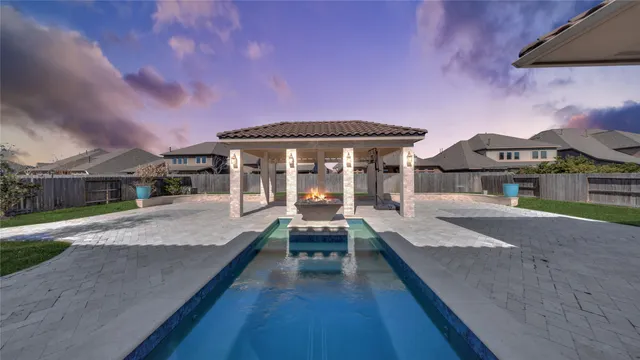 a view of house in front of house with deck area