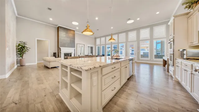 a bathroom with a double vanity sink and a large mirror