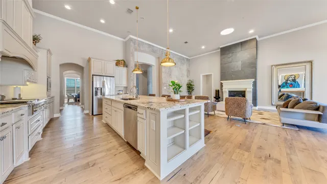 a large kitchen with stainless steel appliances granite countertop a lot of counter top space