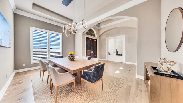 a view of a dining room with furniture and window