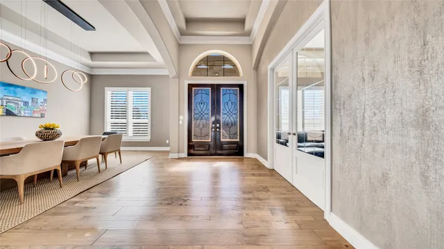 wooden floor in a hall with a window