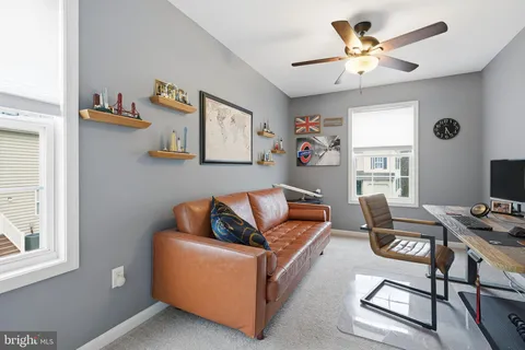 a workspace with furniture and window