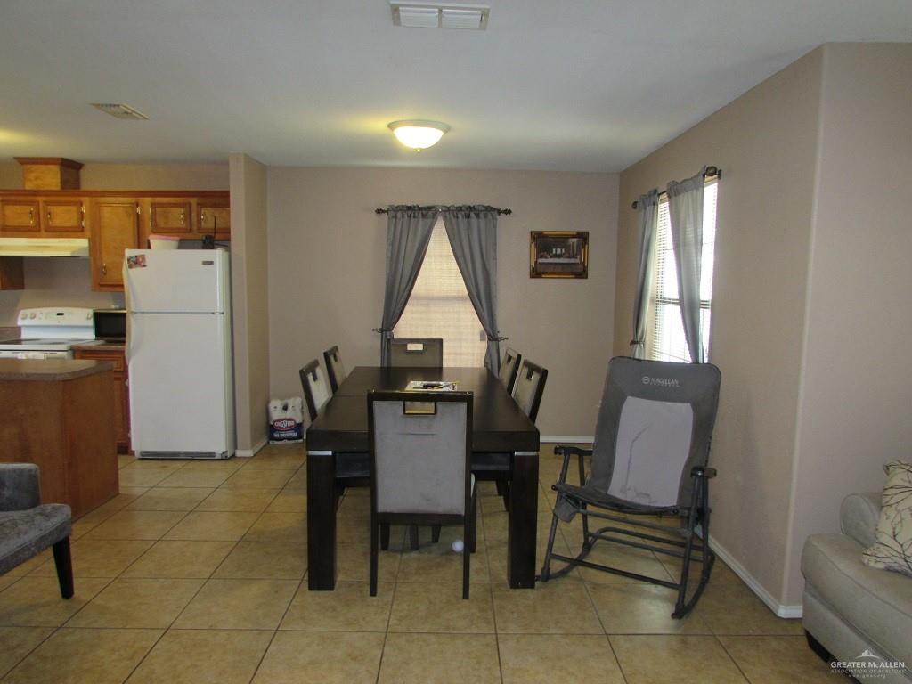2936 Jasmine Street Roma, TX 78584 - Photo 7 of 12 a view of a workspace with furniture and a window