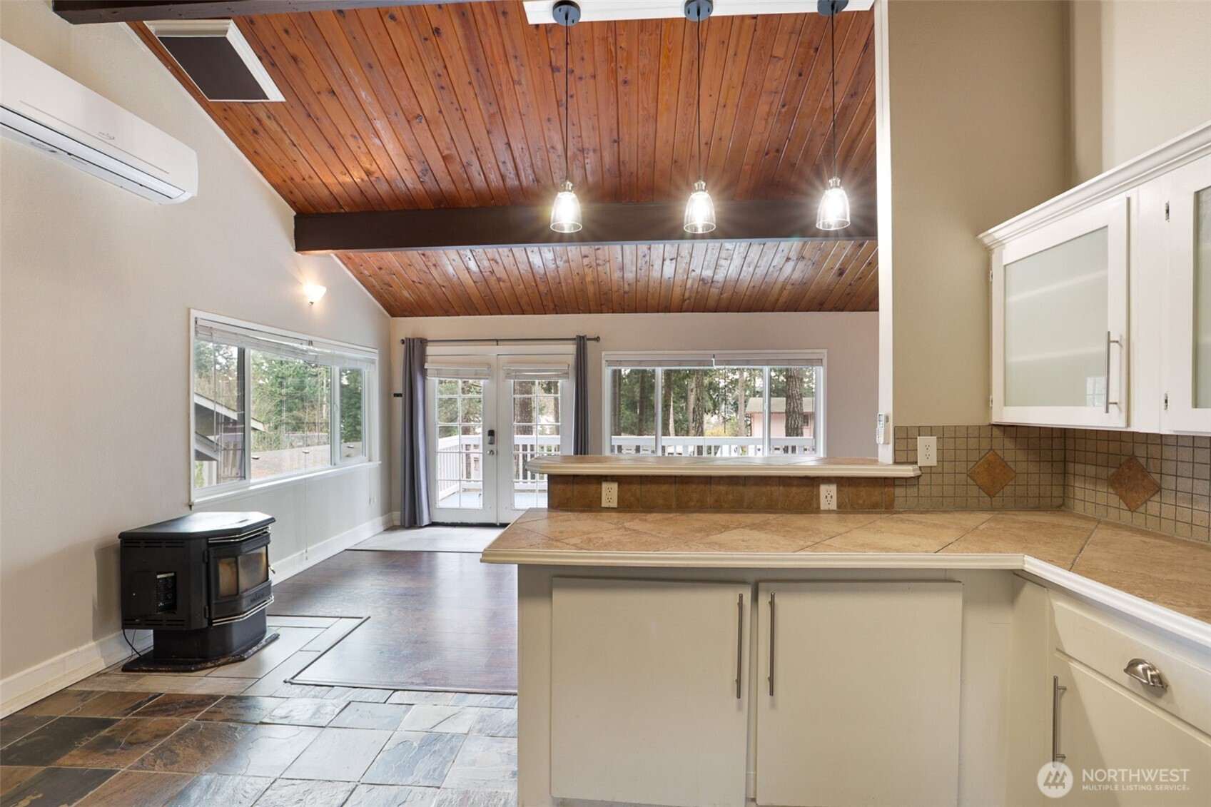 41 Barbara Lane Belfair, WA 98528 - Photo 12 of 28 a kitchen with a large window cabinets and stainless steel appliances
