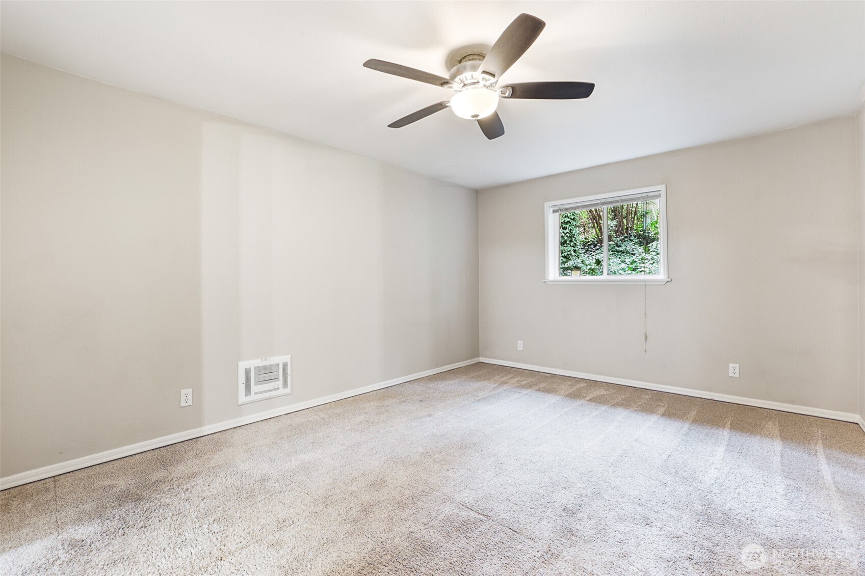 41 Barbara Lane Belfair, WA 98528 - Photo 16 of 28 an empty room with a ceiling fan and a window
