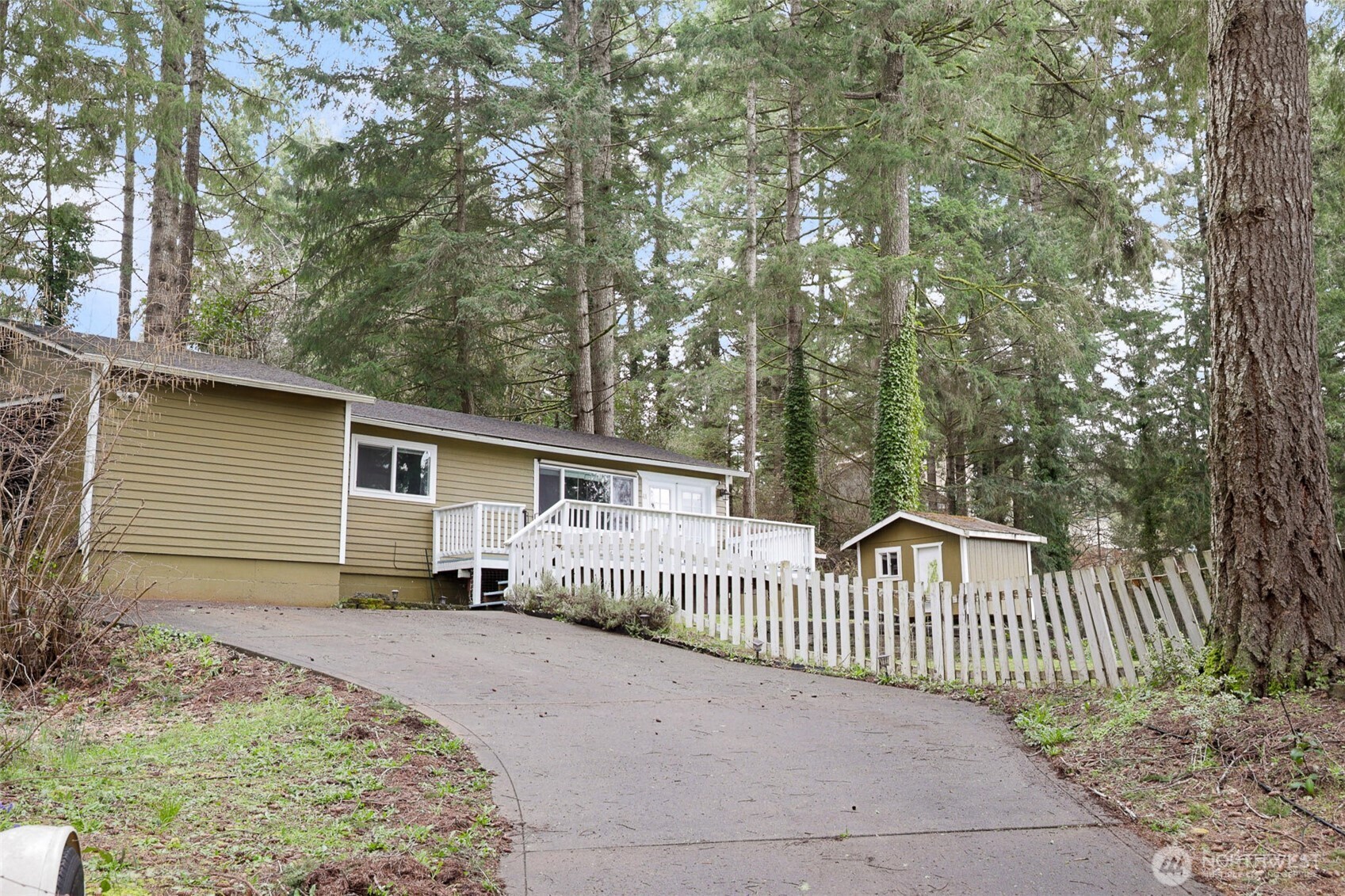 41 Barbara Lane Belfair, WA 98528 - Photo 3 of 28 a view of a house with a yard and fence
