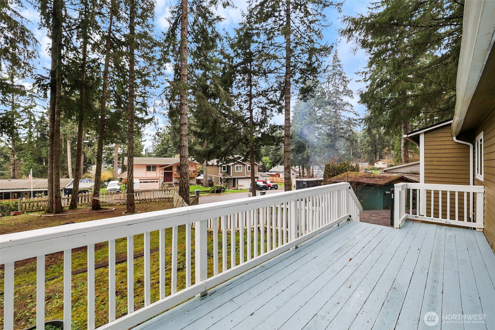 41 Barbara Lane Belfair, WA 98528 - Photo 6 of 28 a view of a balcony with wooden floor and fence