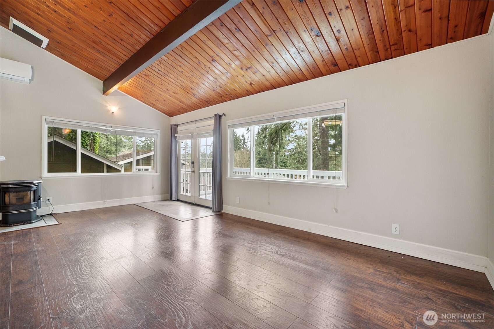 41 Barbara Lane Belfair, WA 98528 - Photo 9 of 28 a big room with wooden floor and windows