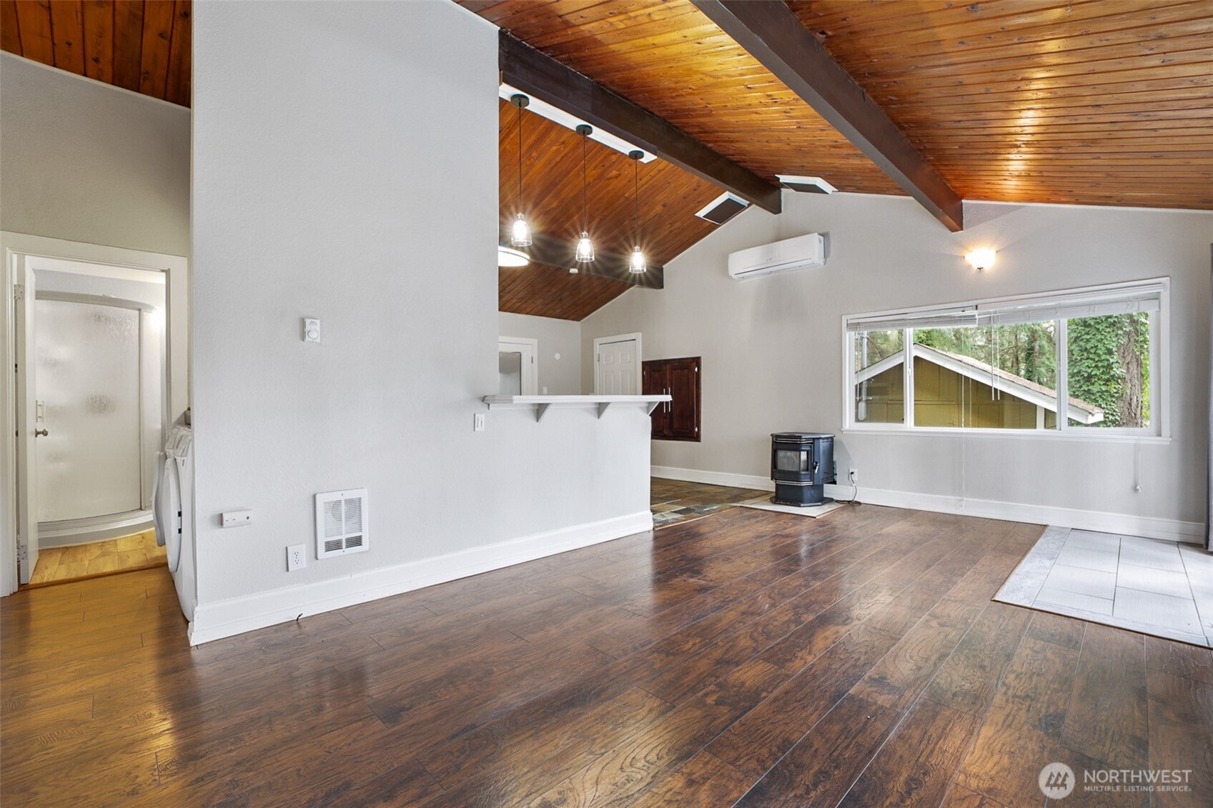 41 Barbara Lane Belfair, WA 98528 - Photo 10 of 28 an empty room with wooden floor and windows