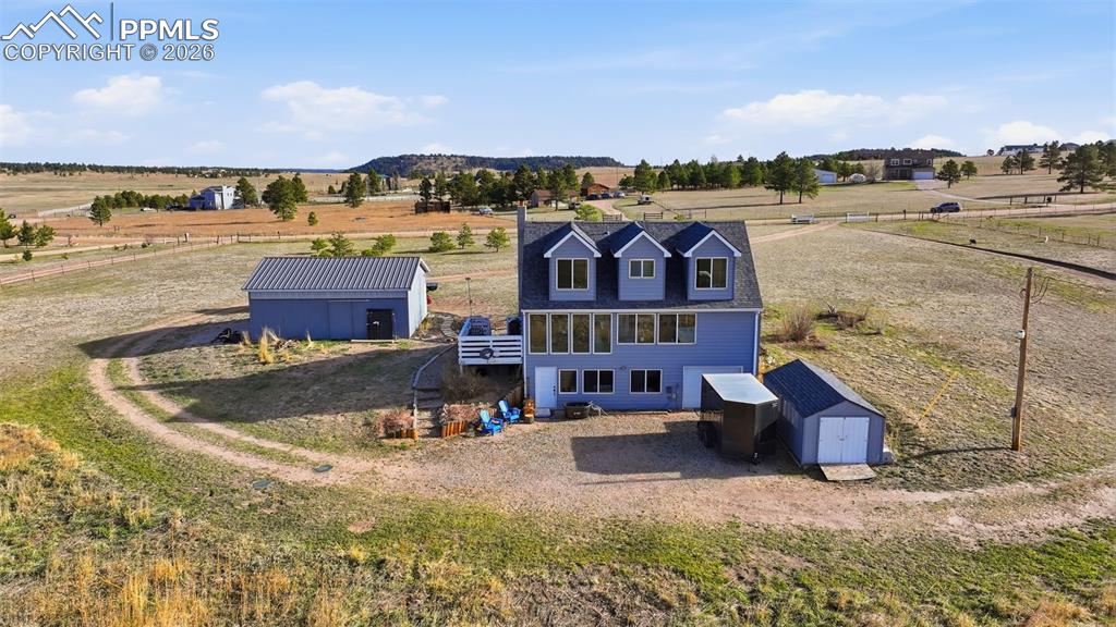 12285 Old Barn Road Elbert, CO 80106 - Photo 37 of 39 a view of a lake with a building in the background