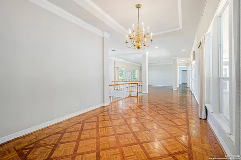 a view of an empty room with glass door