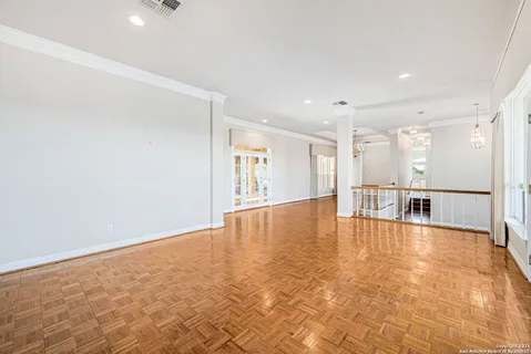 a spacious bathroom with a tub sink and mirror