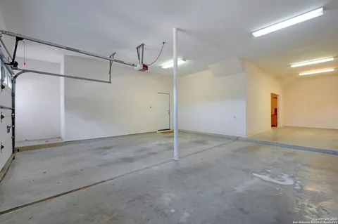 a view of a patio with table and chairs and potted plants