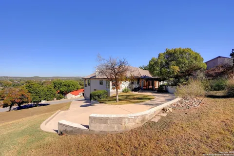 a view of outdoor space with garden and trees
