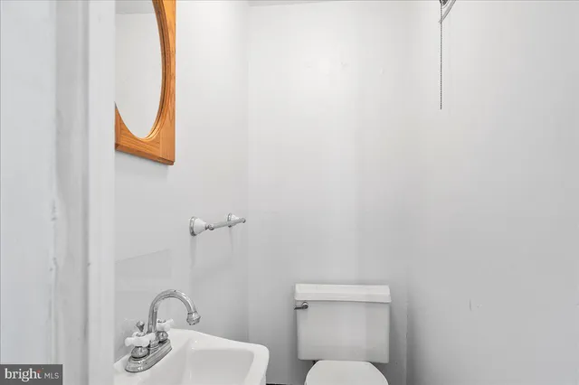 a bathroom with a bathtub a sink a mirror and a shower