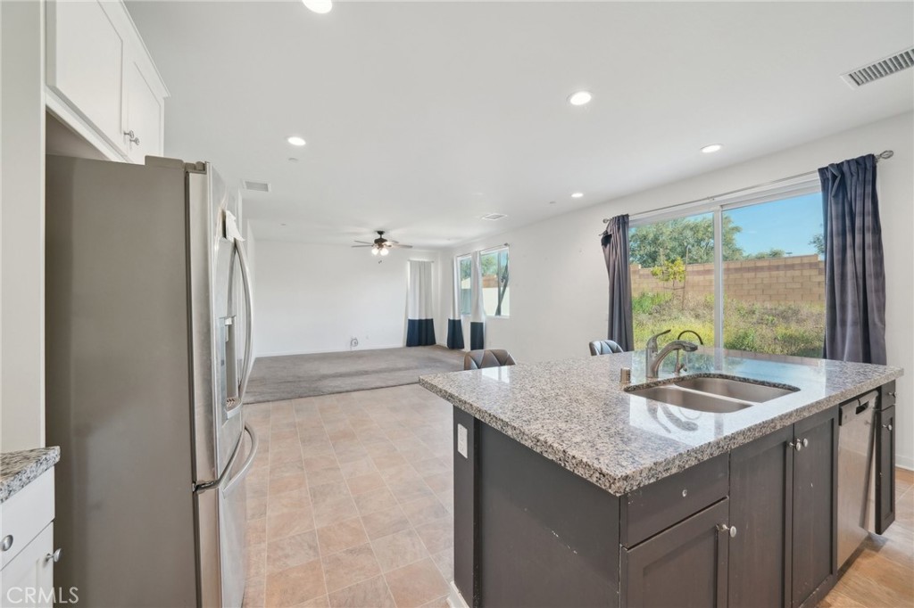 36927 Arezzo Court Beaumont, CA 92223 - Photo 12 of 53 a bathroom with a granite countertop sink and a large mirror