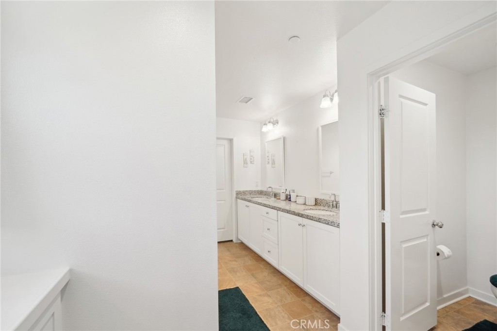 36927 Arezzo Court Beaumont, CA 92223 - Photo 19 of 53 a view of a kitchen from the hallway