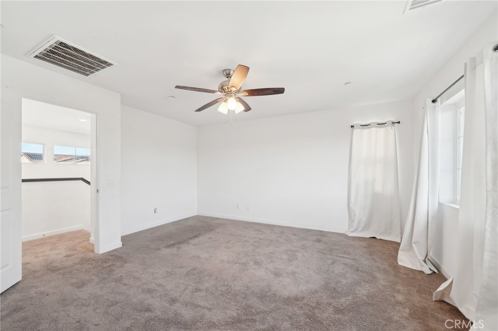 36927 Arezzo Court Beaumont, CA 92223 - Photo 23 of 53 a view of a ceiling fan in a room