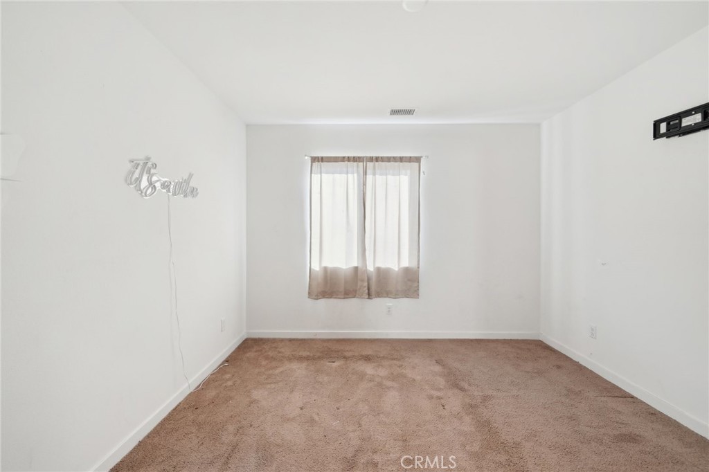 36927 Arezzo Court Beaumont, CA 92223 - Photo 25 of 53 an empty room with a window