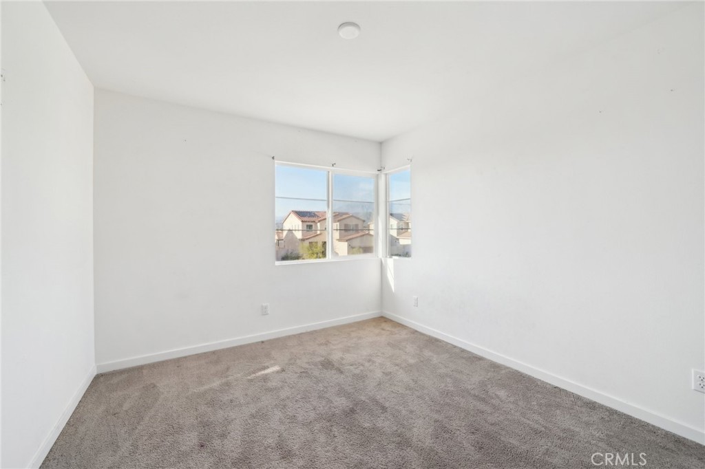 36927 Arezzo Court Beaumont, CA 92223 - Photo 31 of 53 an empty room with windows