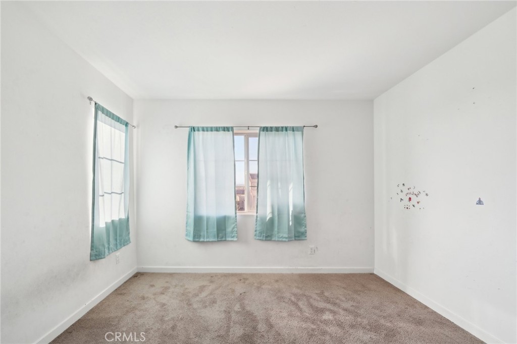 36927 Arezzo Court Beaumont, CA 92223 - Photo 35 of 53 an empty room with windows