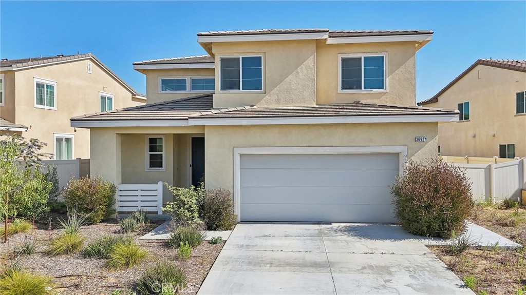 36927 Arezzo Court Beaumont, CA 92223 - Photo 38 of 53 a front view of a house with garden