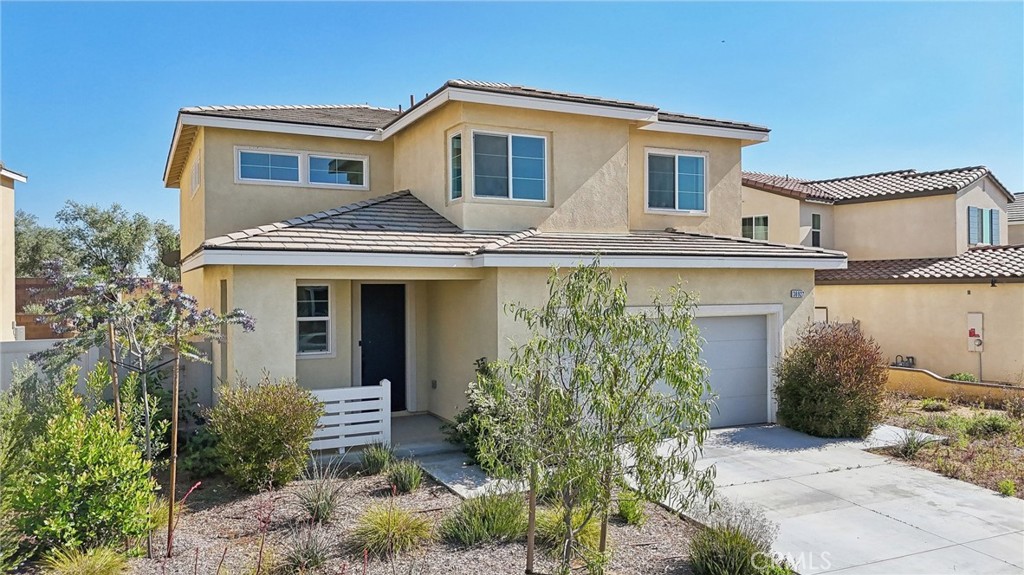 36927 Arezzo Court Beaumont, CA 92223 - Photo 40 of 53 a front view of a house with garden