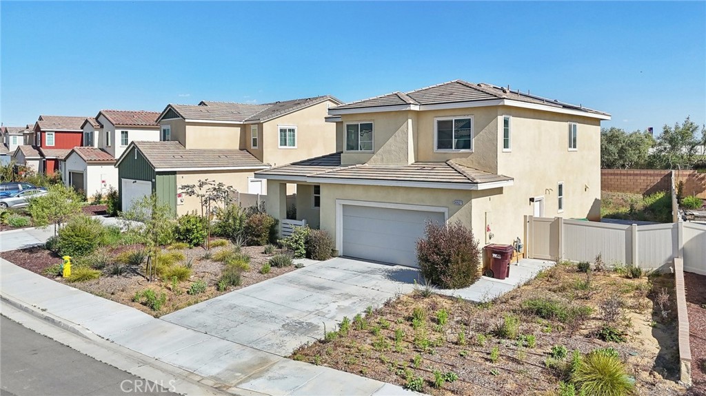 36927 Arezzo Court Beaumont, CA 92223 - Photo 43 of 53 a front view of a house with a yard