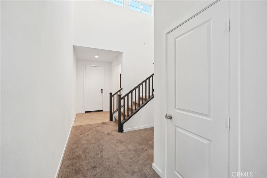 36927 Arezzo Court Beaumont, CA 92223 - Photo 6 of 53 a view of a hallway with staircase