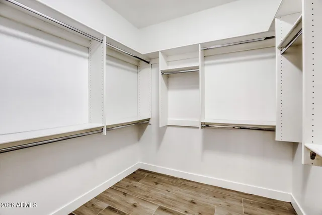 a view of an empty walk in closet