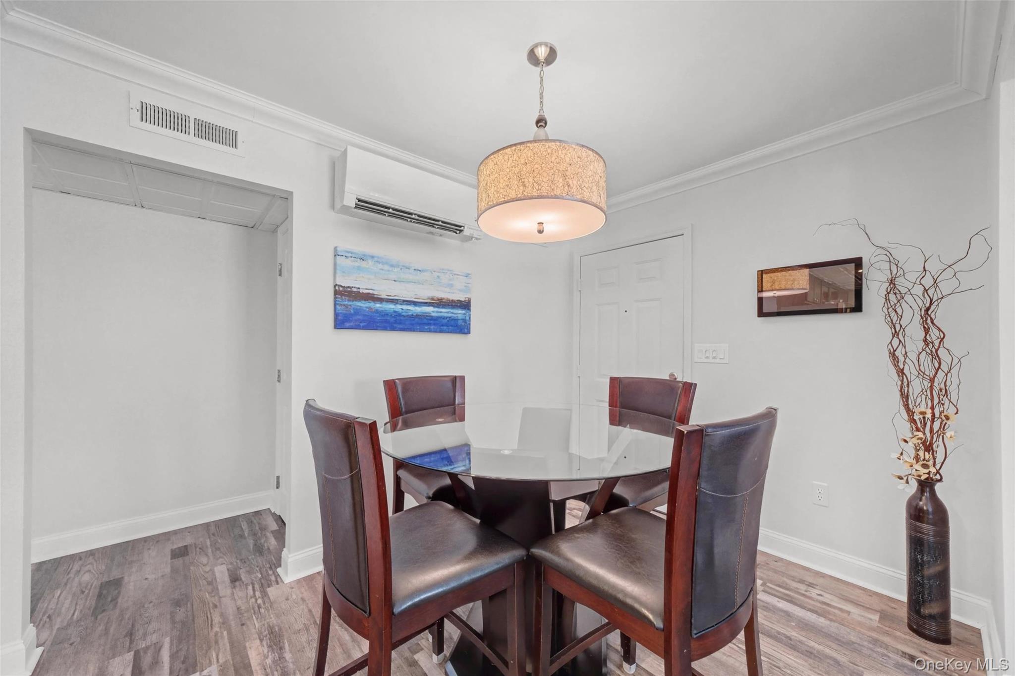 32 Hurlihe Street, Unit A Poughkeepsie, NY 12601 - Photo 10 of 21 a view of a dining room with furniture wooden floor and a chandelier