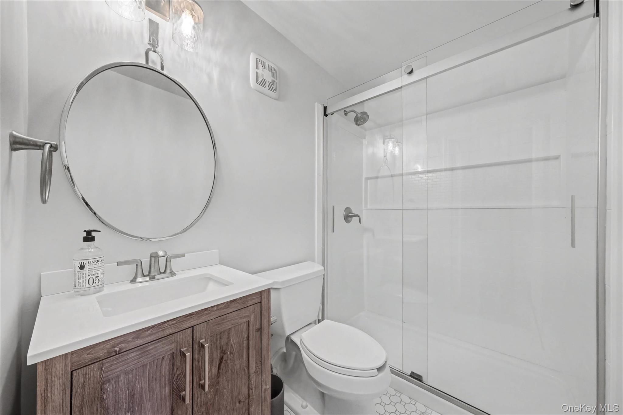 32 Hurlihe Street, Unit A Poughkeepsie, NY 12601 - Photo 13 of 21 a bathroom with a sink a toilet and shower