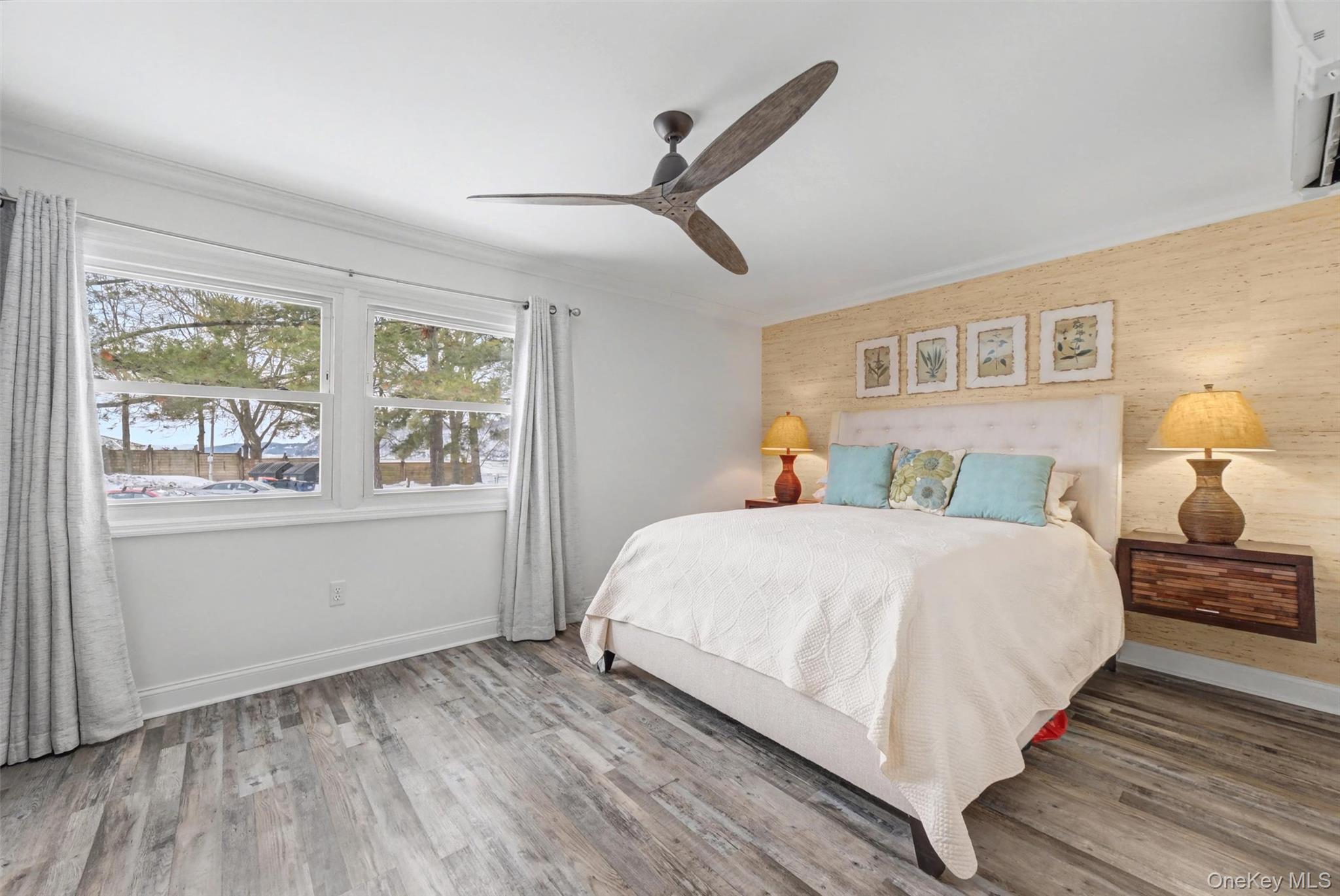 32 Hurlihe Street, Unit A Poughkeepsie, NY 12601 - Photo 14 of 21 a bedroom with a large bed and wooden floor