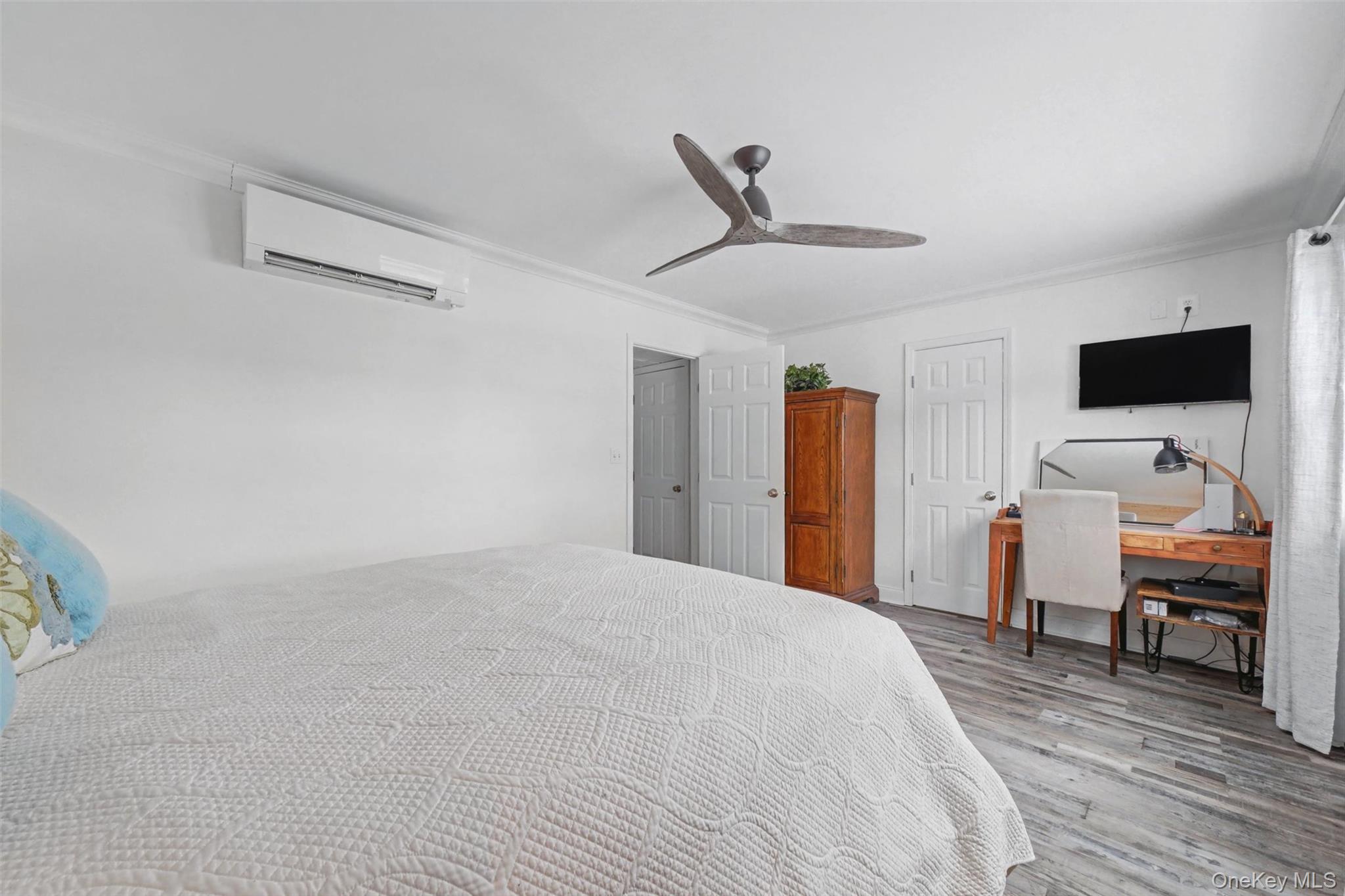32 Hurlihe Street, Unit A Poughkeepsie, NY 12601 - Photo 17 of 21 a bedroom with a bed and a flat screen tv