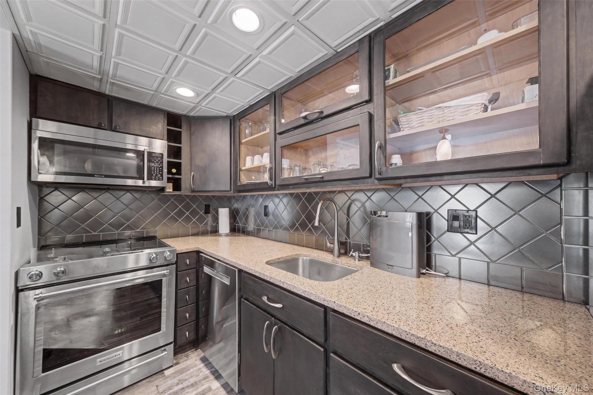 32 Hurlihe Street, Unit A Poughkeepsie, NY 12601 - Photo 9 of 21 a kitchen with stainless steel appliances granite countertop a sink and a microwave