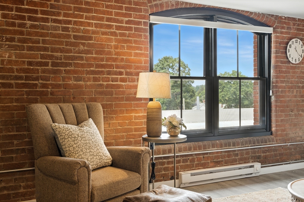 55 Sterling Street, Unit 212 Clinton, MA 01510 - Photo 20 of 35 a living room with furniture and a window