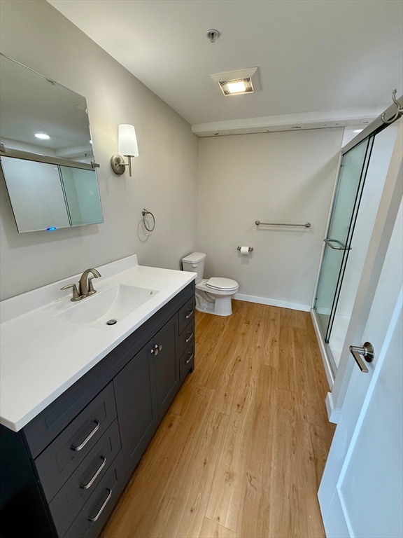 55 Sterling Street, Unit 212 Clinton, MA 01510 - Photo 9 of 35 a spacious bathroom with a double vanity sink and a mirror