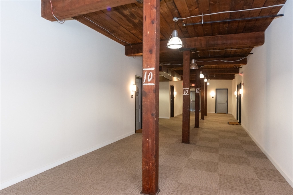 55 Sterling Street, Unit 212 Clinton, MA 01510 - Photo 10 of 35 a view of a hallway with wooden floor