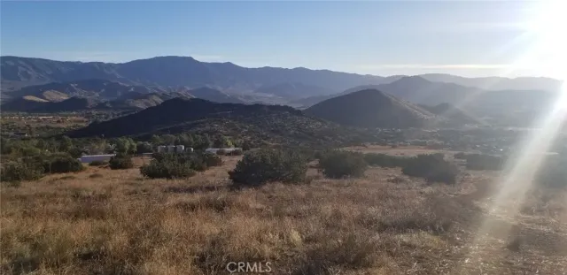 a view of mountain view with mountains in the background