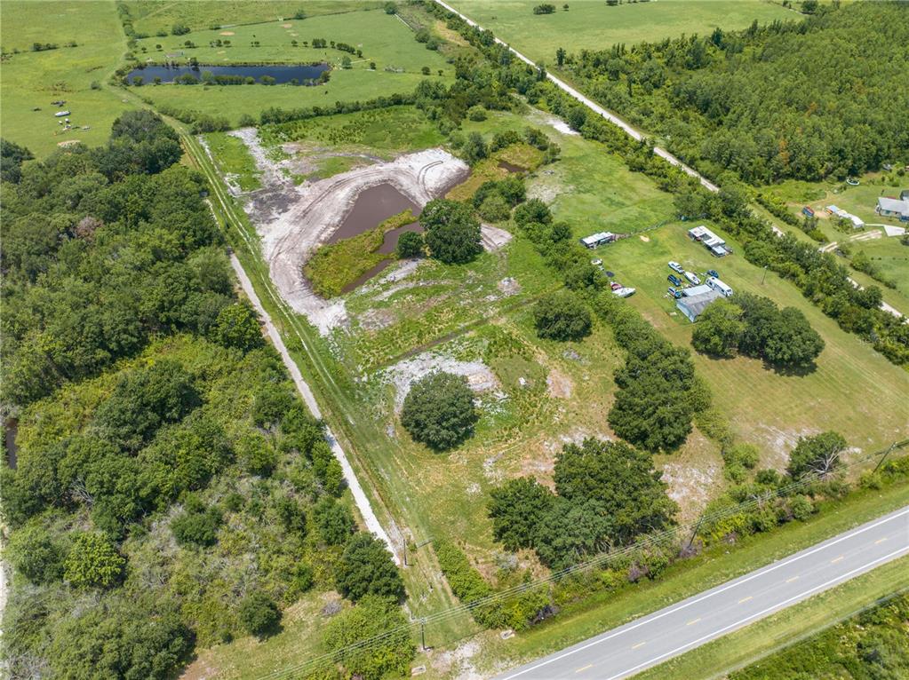 5420 Holopaw Road St. Cloud, FL 34773 - Photo 4 of 16 an aerial view of residential houses with outdoor space