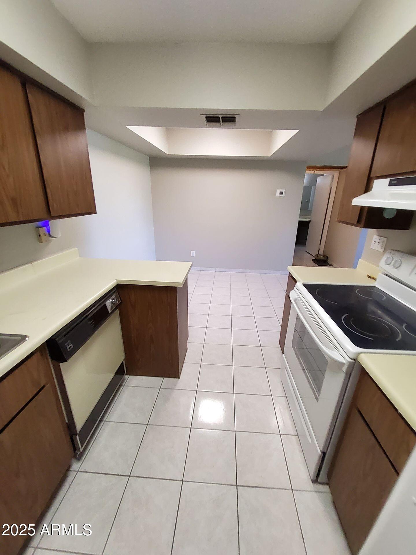 4444 East Paradise Village Parkway North, Unit 231 Phoenix, AZ 85032 - Photo 3 of 7 a bathroom with a sink a toilet and mirror