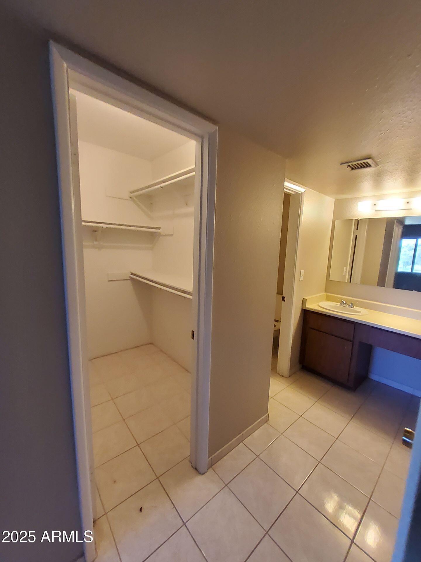 4444 East Paradise Village Parkway North, Unit 231 Phoenix, AZ 85032 - Photo 6 of 7 a bathroom with a tub and a shower