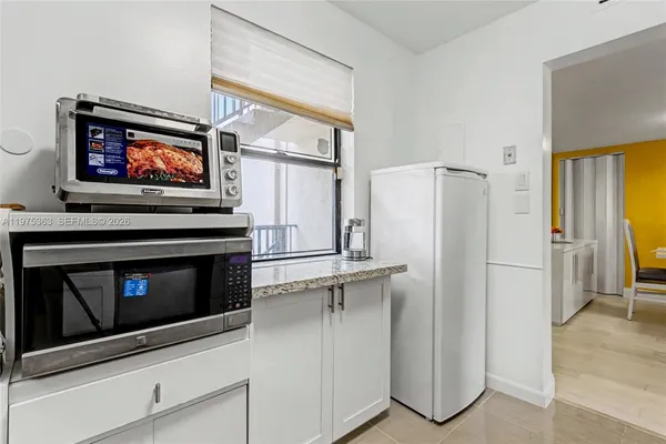 a kitchen with a refrigerator stove and a sink
