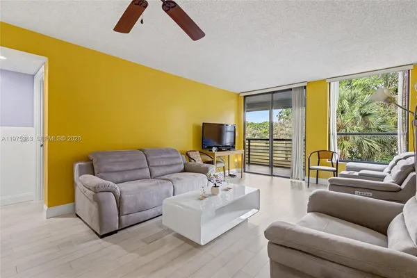 a living room with furniture and a large window