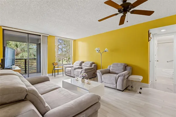 a living room with furniture and a large window
