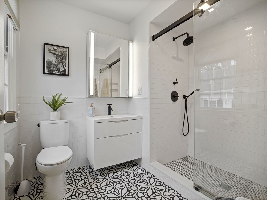 44 A Orchardhill Road, Unit A Boston, MA 02130 - Photo 12 of 37 a bathroom with a sink toilet and shower