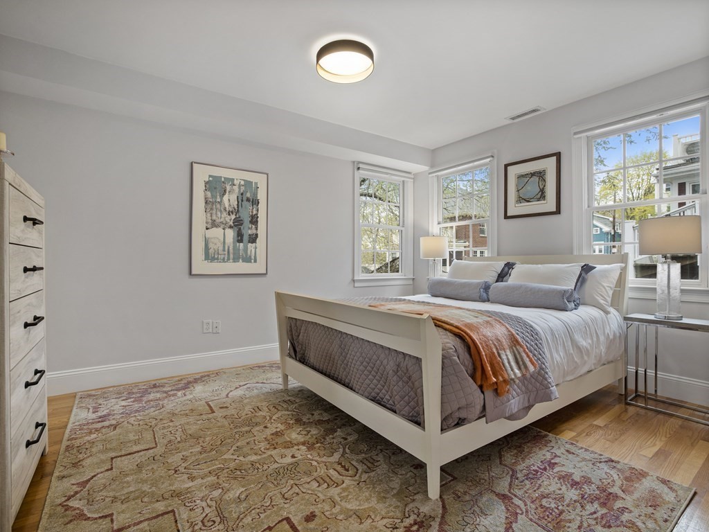 44 A Orchardhill Road, Unit A Boston, MA 02130 - Photo 13 of 37 a spacious bedroom with a bed and a window