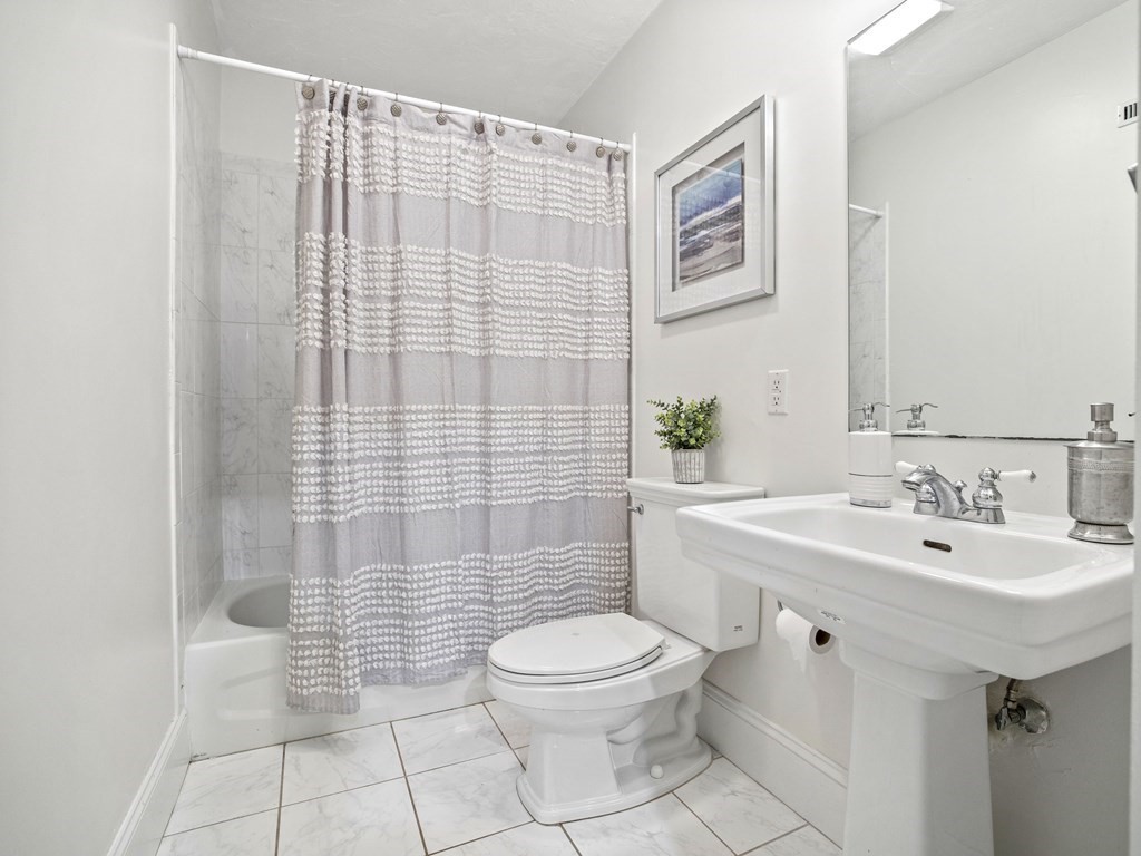 44 A Orchardhill Road, Unit A Boston, MA 02130 - Photo 18 of 37 a bathroom with a sink toilet and shower
