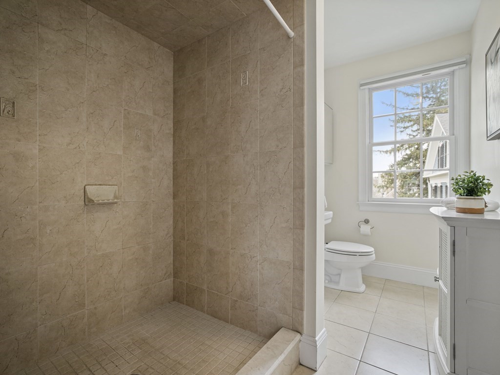 44 A Orchardhill Road, Unit A Boston, MA 02130 - Photo 19 of 37 a bathroom with a toilet and a shower
